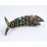 A mother of pearl and abalone shell articulated model, of a fish, length 7.5ins