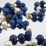 A lapis lazuli and cultured pearl necklace, 84cm long