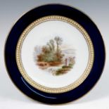 A 19th century Grainger's Worcester cabinet plate, decorated with a landscape of two figures by a