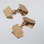 A pair of 9 carat gold cufflinks, the one plain and one engine turned rectangular panels with
