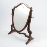 A mahogany framed dressing table mirror, with shield shaped mirror, raised on side supports, overall