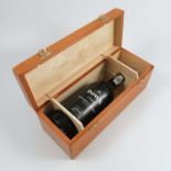 A cased bottle of Dow's 1985 Vintage Port, in wooden box