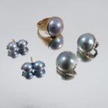 A grey Mabe pearl ring, stamped '9ct', finger size Q 1/2, 12g gross, together with a pair of grey