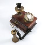 A vintage wall mounted telephone, in brass and mahogany, impressed GPO No 1 to the back