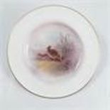 A Royal Worcester plate, decorated with partridge
