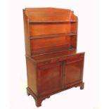 A 19th century mahogany cabinet, with shelves to the upper section, the base fitted with two