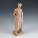 A carved alabaster model, of a man, wearing a cloak, with laurel wreath on his head, on square base,