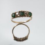 A diamond and emerald five stone ring, unmarked, the two old brilliant cuts totalling