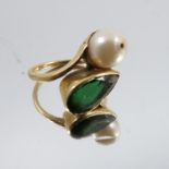 A green tourmaline and cultured pearl two stone ring, stamped '18ct', finger size I 1/2, 5.2g gross