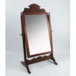 A swing frame toilet mirror, plate dimensions 13.5ins x 8.5ins