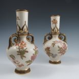A pair of Royal Worcester gilded ivory vases, decorated with flowers and having a pair of gilt