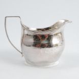 A Georgian silver jug, with band of bright cut decoration, engraved with initials, London 1807,