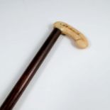 A 19th century ivory handled walking stick, the handle inscribed Milton Brook 1831 and Mrs Smith,