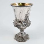 A Georgian silver pedestal cup, the flared bowl with gilt wash interior, decorated with raised
