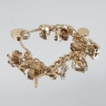 A 9 carat gold bracelet, of solid curb links, with fifteen charms attached, 39g gross, together with
