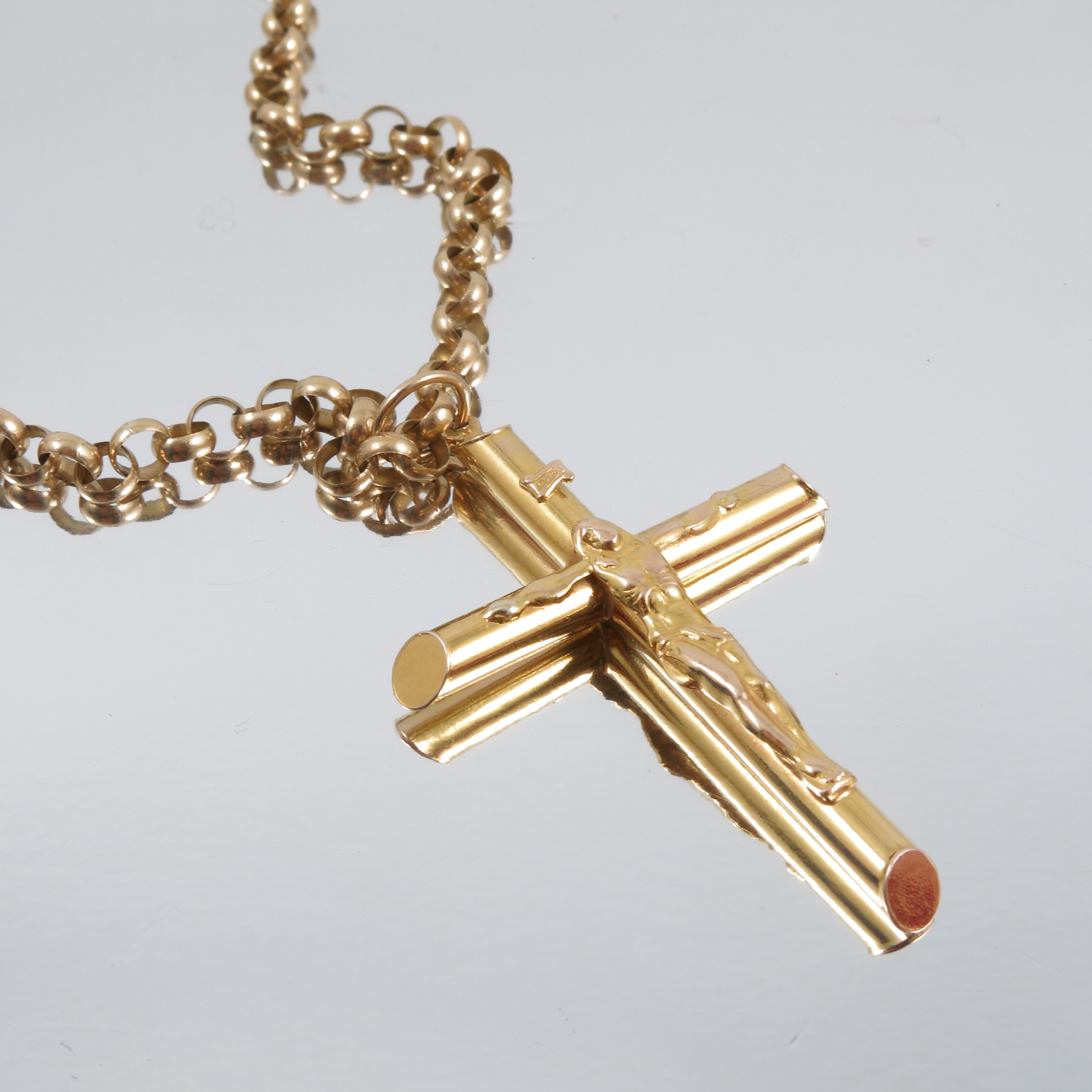 A 9 carat gold crucifix pendant, on a 9 carat gold round belcher link chain, 19g grossCondition