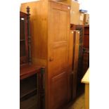 A Peter Waals oak single door wardrobe, from Loughborough University, with triple panel door, fitted