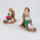 A pair of 19th century figures, seated male and female with dog, sheep and flowers, height 5.