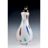 A 1950's milk glass lamp, of baluster form, decorated with multi coloured abstract pattern, height