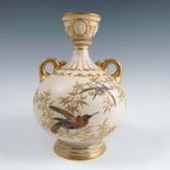 A Royal Worcester gilded ivory vase, the bulbous body decorated with birds on a gilt branch, dated