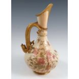 A Royal Worcester blush ivory ewer, the bulbous fluted body decorated with flowers, having a gilt