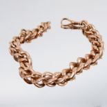 A bracelet, stamped '585', of solid curb links, with a swivel catch, 21.5cm long, 31g gross