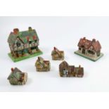 Six Crown Staffordshire models, of houses to include cottage pastille burners, together with a