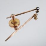 A gold stick pin, set with a single diamond, together with another gold stick pin set with a