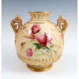A Royal Worcester blush ivory two handled vase, decorated with poppies and insects, with pierced