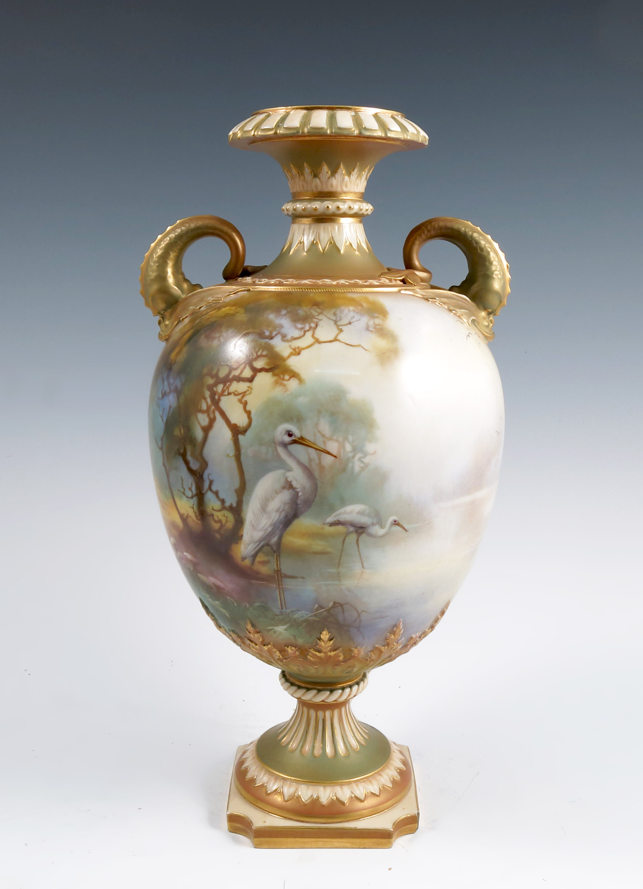 A Royal Worcester vase, decorated all around with storks in a river landscape by W Powell, having