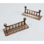 A pair of silver plated knife rests, of rectangular form, with ball finials, length 3.25ins