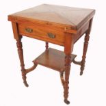 An Edwardian envelope card table, raised on four turned legs, united by a plant shelf, width
