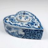 A Delft pottery tin glazed inkwell, of heart shape, the top decorated with flowers, the sides with