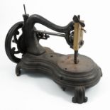 A 19th century sewing machine, having a cast iron base