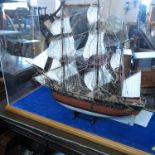 A scratch built model of HMS Bounty, in a plastic case, 1:50 scale