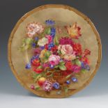 A Royal Worcester plate, fully painted with a still life study of flowers and fruit in a vase in the