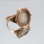 A hardstone intaglio ring, stamped '9ct', carved with the profile of an elderly classical male
