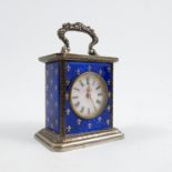 A French miniature enamelled clock, of rectangular form, with scroll handle to top, the silver