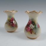 A pair of Royal Worcester vases, with frilly edge, decorated with flowers, shape number 2492.