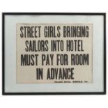 A black printed sign, Street girls bringing sailors into hotel must pay for room in advance,