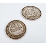 Three silver coloured seals, of disc form, intaglio carved with a knight on horse back and text,