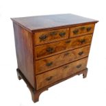 An 18th century walnut chest of drawers, with cross banded decoration, having two short drawers over