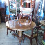 A Victorian mahogany circular tilt top table, raised on a turned column terminating in a platform
