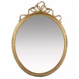 A gilt frame wall mirror, of oval form, with bevelled mirror plate, the frame decorated with gilt