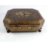 A 19th century Oriental black lacquer and gilt games box, of octagonal form, the lid and sides