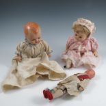 A collection of dolls, to include two with moulded heads, two costume dolls, a plush tiger, a