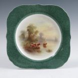 An unmarked Royal Worcester square shaped plate, decorated with English cattle watering in