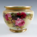 A Royal Worcester small jardiniere, decorated to the front with roses by K H Blake, shape number