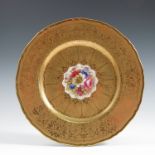 A Royal Worcester cabinet plate, the centre decorated with flowers by Freeman, to a deep acid etched