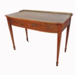 An Edwardian writing table, with brass gallery, having leather inset and chequer band decoration,
